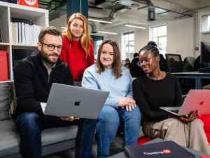 Countingup team working around a laptop